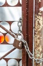 The old iron gate is locked with a chain. Breaking and entering private property. Closed Secret Zone Royalty Free Stock Photo