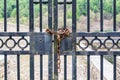 Old iron gate with rusted chain and a lock Royalty Free Stock Photo