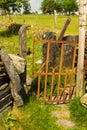 Old iron gate stile in dry stone wall