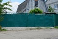 Iron gates and wicket green on the street