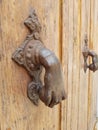 Antique iron handle on a wooden door Royalty Free Stock Photo