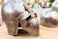 Old iron helmet with visor protection of medieval warrior rider lies on a wooden table Royalty Free Stock Photo