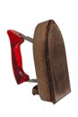 Old iron isolated. Close-up of a professional old rusty electric tailor iron or flatiron with a red handle isolated on a white Royalty Free Stock Photo