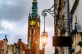 Old iron lantern on the background of the town\'s main town hall Gdansk Poland Royalty Free Stock Photo