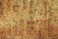 An old iron or metallic surface, background, texture. Yellow wall or plane with peeling and cracked paint Royalty Free Stock Photo