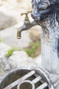 Old iron rusty faucet closed, without water flowing