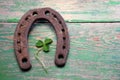 Old iron rusty metal horseshoe on weathered wood Royalty Free Stock Photo