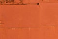 Old iron sheet with peeling brown paint and rusty spots Royalty Free Stock Photo