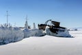 Old iron ship covered with ice at lake in winter Royalty Free Stock Photo