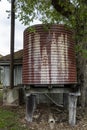 Old Iron Tank Stand On Wooden Posts