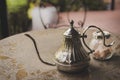 Old iron tea pot with sugar on the table Royalty Free Stock Photo