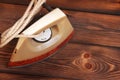 Old iron on wooden background Royalty Free Stock Photo
