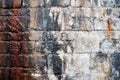 Old irregular wet stone wall with damp marks and water streaks of calcified mineral limestone beginning to form in shades brown Royalty Free Stock Photo