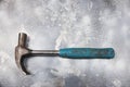 Old isolated hammer on cement background