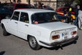 Old Italian Alfa Romeo Giulia Nuova Super 1.6 of the second generation in the color white Royalty Free Stock Photo