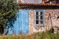 Old italian house in disrepair with blue door Royalty Free Stock Photo