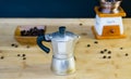 Old Italian Moka coffee maker, manual coffee grinder in the background Royalty Free Stock Photo