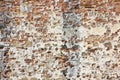 Old italian stone and brick wall with degraded plaster Royalty Free Stock Photo
