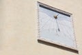 Old Italian vertical sundial on a building facade