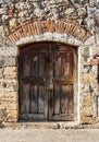 Old italian wooden door in Monteriggioni, Italy Royalty Free Stock Photo