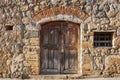 Old italian wooden door in Monteriggioni, Italy Royalty Free Stock Photo