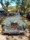 Old 1958 Jaguar MK 8 luxury sedan under the trees. Sunny day. Autoclasica 2022 classic car show.