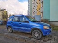 Old Japanese compact car blue Suzuki Ignis parked Royalty Free Stock Photo