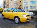 Old Japanese compact car yellow Nissan Micra parked Royalty Free Stock Photo