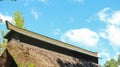 Old japanese farmer house roof with sky as background on sunny day Royalty Free Stock Photo