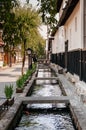 Old Japanese houses on street and small natural stream of Hida F