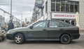 Old dark green sedan car Mitsubishi Carisma parked Royalty Free Stock Photo