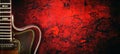 Old, jazz electric guitar on a red grunge background. Copy space. Background for music festivals, concerts. Musical education. Royalty Free Stock Photo