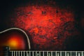 Old, jazz electric guitar on a red grunge background. Copy space. Background for music festivals, concerts. Musical education. Royalty Free Stock Photo