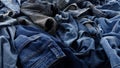 Old jeans. Used clothes. Rapid Consumption: A throwaway culture and overflowing closet problem result in textile waste