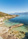 Old jetty and coastline of Desert des Agriates in Corsica Royalty Free Stock Photo
