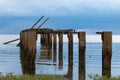 Old jetty on the shoreline of Snettisham beach Royalty Free Stock Photo