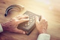 Old Jewish man hands holding a Prayer book, praying, next to shofar (horn). Jewish traditional symbols. Rosh hashanah (jewish New Royalty Free Stock Photo