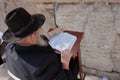 Old jewish man reading Tora at the Wailing Wall