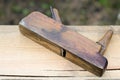 Old jointer on wooden background, carpentry tool Royalty Free Stock Photo