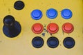 Old joystick and colorful buttons of a slot machine