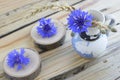 Old jug with cornflowers and ears of wheat