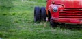 Old Junked Red Work Truck Abandoned in Green Field Royalty Free Stock Photo
