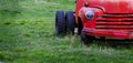 Old Junked Red Work Truck Abandoned in Green Field