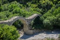 View of the Old Kalogeriko triple arched stone bridge Royalty Free Stock Photo