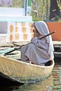 An old Kashmiri woman rowing her Shikara boat on Dal Lake in Srinagar, Jammu and Kashmir, India Srinagar, Jammu and Kashmir, India