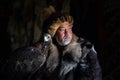 Old kazakh eagle hunter with his golden eagle Royalty Free Stock Photo