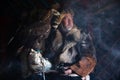 Old kazakh eagle hunter with his golden eagle Royalty Free Stock Photo