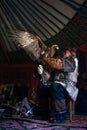 Old kazakh eagle hunter with his golden eagle Royalty Free Stock Photo