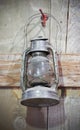 An Old Kerosene Lamp Hanging on a Red Hook