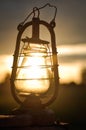 The old kerosene lantern on a tractor at sunset